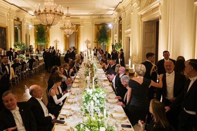 Guests, including Amazon Founder Jeff Bezos, right, mingle as President Donald Trump hosts a state dinner with Great Britain s King Charles and Queen Camilla at the White House on Tuesday, April 28, 2026 in Washington, D.C. Charles spoke to a joint session of Congress earlier in the day, and attended several events with U.S. President Donald Trump.  WAX20260428237 CraigxHudson