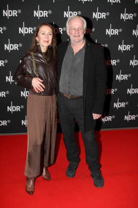 ABB LINDENBERG Aida Sikira Herbrechter, Max Herbrechter, on the red carpet at the Kino Welt Premiere of ARD Dekou UDO Rebell Rockstar Icon at Astor Filmlounge in Hafencity on April 28, 2026 in Hamburg Hamburg Germany