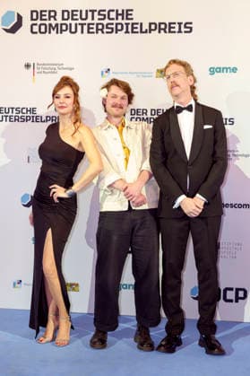 Katrin Bauerfeind, guest and Uke Bosse at the presentation of the German Computer Game Award 2026 in the Herkulessaal of the Munich Residence, 29 04 2026 Foto:xN.xKolinzx xFuturexImagex computerspielpreis_6412