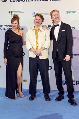 Katrin Bauerfeind, guest and Uke Bosse at the presentation of the German Computer Game Award 2026 in the Herkulessaal of the Munich Residence, 29 04 2026 Foto:xN.xKolinzx xFuturexImagex computerspielpreis_6414