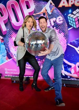 Premiere Roncalli s Apollo Variete POP Culture TV presenter Sven Kroll with girlfriend Lisa Feller with the Disco Ball on the Red Carpet Düsseldorf Apollo Theater NRW Germany