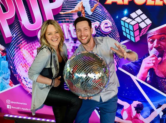 Premiere Roncalli s Apollo Variete POP Culture TV presenter Sven Kroll with girlfriend Lisa Feller with the Disco Ball on the Red Carpet Düsseldorf Apollo Theater NRW Germany