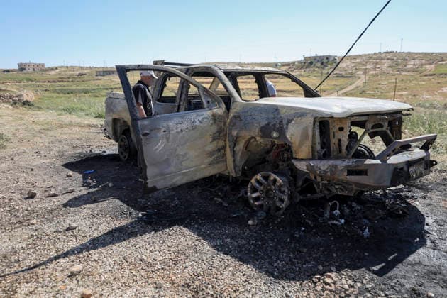 Burned Vehicle Hebron West Bank A man stands next to the burned remains of a Palestinian vehicle in the Wadi al-Rakhim area of Susya village in Masafer Yatta, south of Hebron in the Israeli-occupied West Bank, on May 1, 2026. Local residents said settlers burned the vehicle and wrote anti-Arab slogans on nearby houses. Hebron West Bank Palestinian Territories Copyright: xMosabxShawerx
