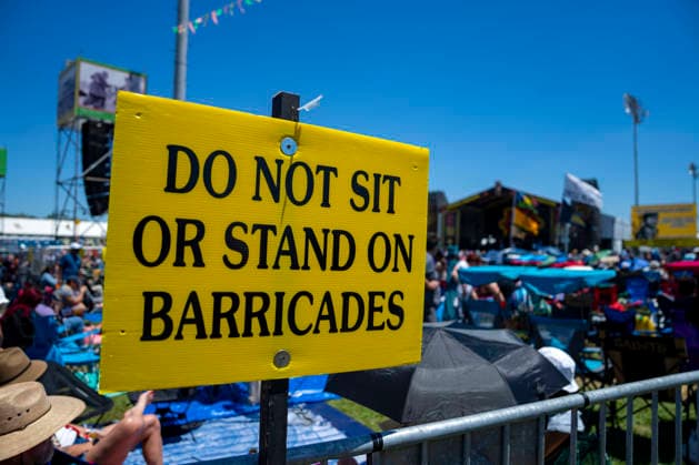 Festival goers set chairs and umbrellas at the Congo Square Stage ahead of Earth, Wind and Fire s performance at the New Orleans Jazz and Heritage Festival at the Fairgrounds Race Courts and Slots in New Orleans, Louisiana on Sunday, May 3, 2026. Organizers expected about 400,000 to attend, but the finally tally, which won t be available for a few days, may be impacted by rain that interrupted festival operations Thursday and Friday.  NOL20260503303 BONNIExCASH