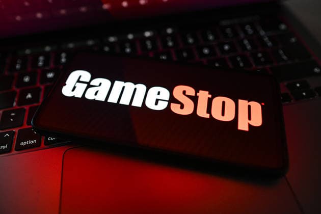Illustration in Poland. In this photo illustration, a GameStop logo is displayed on a smartphone on top of a laptop. Poland Copyright: xOmarxMarquesx xSOPAxImagesx omarques_04052026_tech (11 of 12)