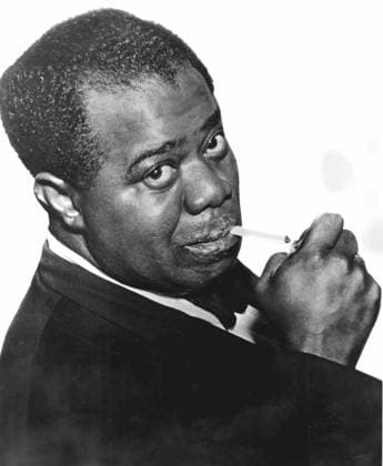 RECORD DATE NOT STATED Photograph of Louis (Satchmo) Armstrong, American jazz trumpeter and singer. Louis (Satchmo) Armstrong (c1898-1971) American jazz trumpeter and singer. Photograph Editorial use only. All other uses to be cleared with the copyright owner (World History Archive), in advance., WHA_004_0954.jpg, Louis Armstrong; Satchmo; American; jazz; trumpeter; singer; musician; legend; iconic; black and white; portrait; performer; New Orleans; Harlem; swing; scat singing; trumpet player; jazz age; music; entertainer; African American; cultural icon; influential; jazz band; soloist; jazz legend; jazz icon; jazz pioneer; jazz history; jazz musician; jazz vocalist. Copyright: xx