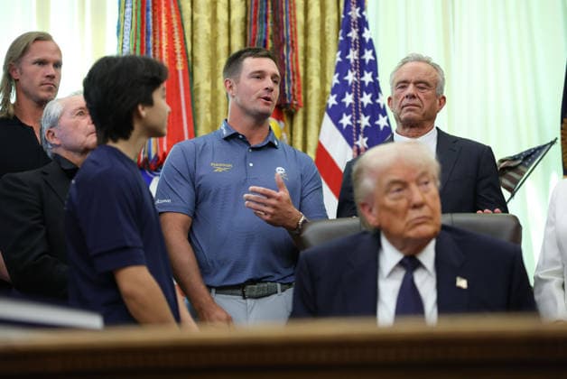 Golfer Bryson DeChambeau speaks as President Donald Trump listens before signing a proclamation inside the Oval Office at the White House in Washington, DC on Tuesday, May 5, 2026. The memorandum is set to restore the Presidential Fitness Test Award, a competitive school-based fitness program last seen under the Obama administration.  WASP20260505106 TomxBrenner