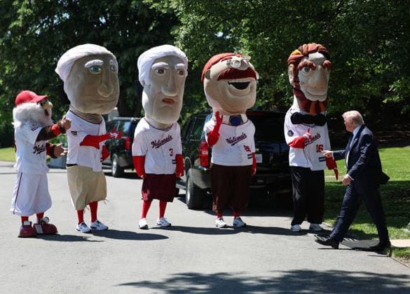 President Donald Trump greets the Washington Nationals Racing Presidents after signing a proclamation inside the Oval Office at the White House in Washington, on Tuesday, May 5, 2026. The memorandum is set to restore the Presidential Fitness Test Award, a competitive school-based fitness program last seen under the Obama administration.  WASP20260505108 TomxBrenner