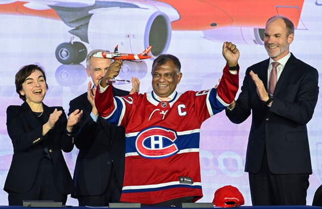 May 6, 2026, Mirabel, Pq, Canada: From left, Quebec Premier Christine Frechette, Prime Minister Mark Carney and CEO, Airbus Commercial Aircraft Lars Wagner, right, applaud AirAsia CEO Tony Fernandes ,centre, during an event at the Airbus A220 Delivery Center in Mirabel, Que., Wednesday, May 6, 2026, where AirAsia placed a landmark order for 150 Airbus A220 aircraft. Mirabel Canada - ZUMAc35_ 20260506_zaf_c35_133 Copyright: xGrahamxHughesx