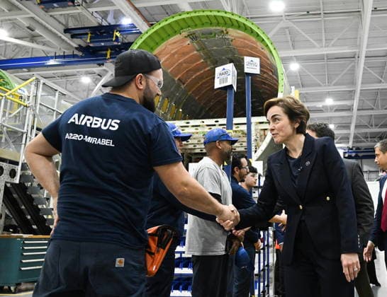 May 6, 2026, Mirabel, Pq, Canada: Quebec Premier Christine Frechette, right, greets an Airbus employee during a tour of their Mirabel facility prior to an event announcing a landmark order by AirAsia for 150 Airbus A220 aircraft in Mirabel, Que., Wednesday, May 6, 2026. Mirabel Canada - ZUMAc35_ 20260506_zaf_c35_181 Copyright: xGrahamxHughesx
