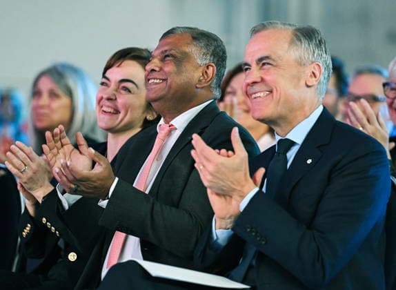 May 6, 2026, Mirabel, Pq, Canada: Quebec Premier Christine Frechette, left, Prime Minister Mark Carney, right, and AirAsia CEO Tony Fernandes look during an event at the Airbus A220 Delivery Center in Mirabel, Que., Wednesday, May 6, 2026, where AirAsia placed a landmark order for 150 Airbus A220 aircraft. Mirabel Canada - ZUMAc35_ 20260506_zaf_c35_183 Copyright: xGrahamxHughesx