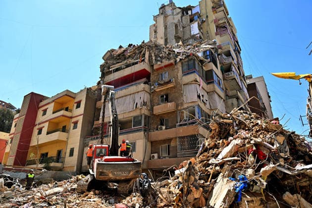 May 7, 2026, Beirut, Lebanon: Lebanese civil defense members clear rubble from the site of a building destroyed by an Israeli air raid in Beirut southern suburb, a bastion for pro-Iranian Hezbollah. Israel confirmed it killed Ahmed Ghaleb Ballout, a commander in Hezbollah s elite Radwan Force in the attack. Beirut Lebanon - ZUMAn313 20260507_zip_n313_002 Copyright: xMarwanxNaamanix