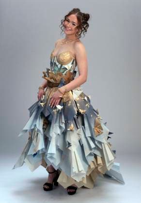 May 07,, 2026 - Denver, Colorado, USA - A model strikes a pose at the 20th Annual Denver Paper Fashion Show. Using only paper to create haute couture, fashion designers created dozens of wearable art designs for this year s show themed Folded in Time. Produced by the One Club for Creativity Denver, the runway show is a fundraiser for Downtown Aurora Visual Arts, which provides after-school arts programs for local youth. Denver USA  - ZUMAce6_ 20260507_zaf_ce6_002 Copyright: xBrianxCahnx