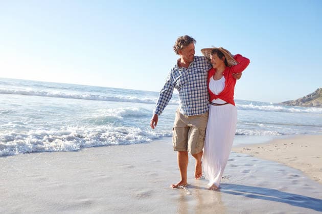 Living, loving and laughing. a mature couple enjoying a late afternoon walk on the beach (License=RF) ,model released, Symbolfoto  Copyright: xZoonar.com KasperxRavlox 20136889 ,model released, Symbolfoto ,property released