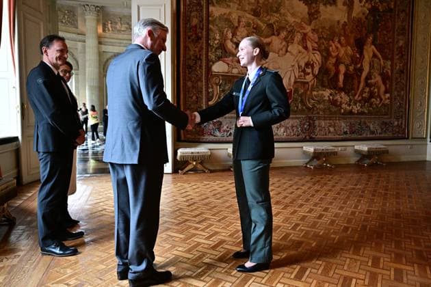 King Philippe - Filip of Belgium and Belgian shorttrack skater Tineke den Dulk pictured during a royal reception for the athletes who competed at the Milano Cortina 2026 Olympic Winter Games, at the Royal Castle in Laken - Laeken, Brussels on Tuesday 12 May 2026. The XXV Winter Olympics took place from 6 to 22 February 2026 in Italy.  DIRKxWAEM 173596133