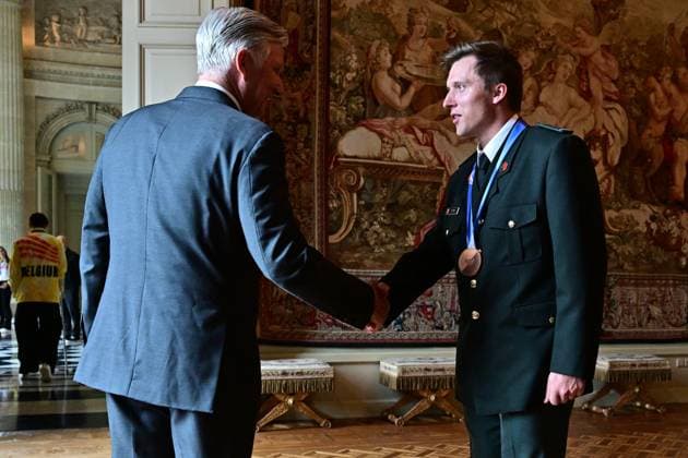 King Philippe - Filip of Belgium and Belgian shorttrack skater Ward Petre pictured during a royal reception for the athletes who competed at the Milano Cortina 2026 Olympic Winter Games, at the Royal Castle in Laken - Laeken, Brussels on Tuesday 12 May 2026. The XXV Winter Olympics took place from 6 to 22 February 2026 in Italy.  DIRKxWAEM 173596219