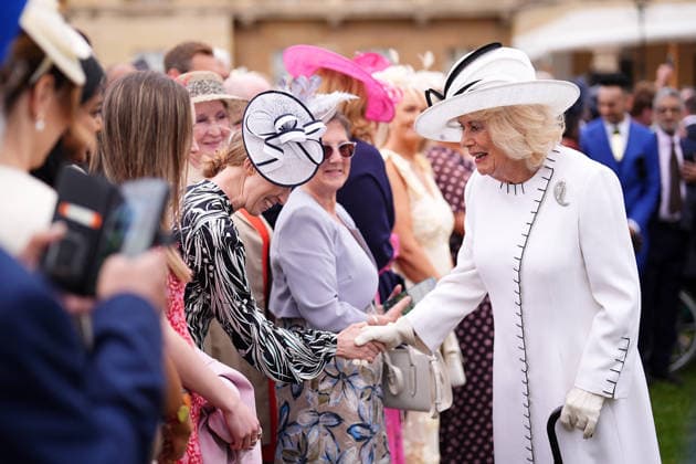 Royal Garden Party at Buckingham Palace Queen Camilla (right) greets guests during a Royal Garden Party at Buckingham Palace, London, to celebrate frontline workers from across the United Kingdom and recognise the dedication and contribution of those who serve their communities through volunteering, supporting charitable causes and working for emergency services. Picture date: Tuesday May 12, 2026., Credit:Aaron Chown PA ROTA - B68 Avalon UK, London  Copyright: xAaronxChownx xPAxROTAx-xB68x xAvalonx 1098334901