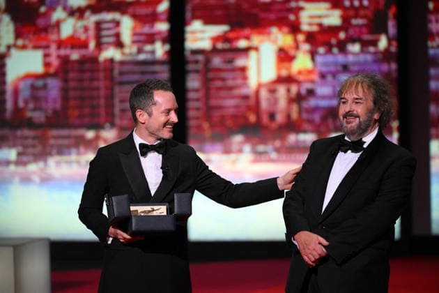 Cannes - Opening Ceremony Peter Jackson (R) receives the Honorary Palme d Or from Elijah Wood (L) during the Opening Ceremony as part of the 79th Cannes Film Festival in Cannes, France on May 12, 2026. Photo by Eliot Blondet ABACAPRESS.COM Cannes France  Copyright: xBlondetxEliot ABACAx