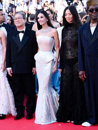IPA84605650 - Cannes, 79th Cannes Film Festival 2026, opening red carpet Pictured: Park Chan-wook, Demi Moore, Chloe Zhao  Copyright: xTerenghi Ipa-Agency.netx xPoolxPhotoxEventsx07x 84605650