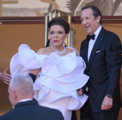 CANNES, FRANCE May 12, 2026 Joan Collins Percy Gibson at the Grand Opening and premiere for The Electric Kiss at the 79th Festival de Cannes Picture Paul Smith Featureflash 455849 2026 05 12 Cannes France  Copyright: xPaulxSmithx xFeaturesxFlashx xStarfacex STAR_455849_128