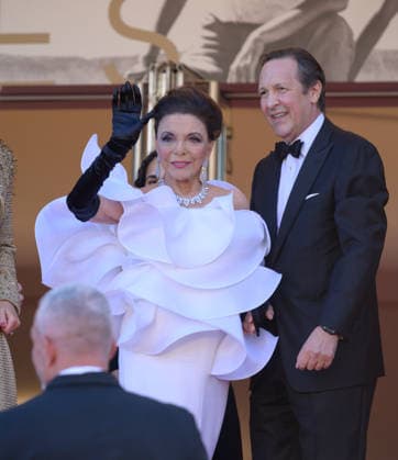 CANNES, FRANCE May 12, 2026 Joan Collins Percy Gibson at the Grand Opening and premiere for The Electric Kiss at the 79th Festival de Cannes Picture Paul Smith Featureflash 455849 2026 05 12 Cannes France  Copyright: xPaulxSmithx xFeaturesxFlashx xStarfacex STAR_455849_130