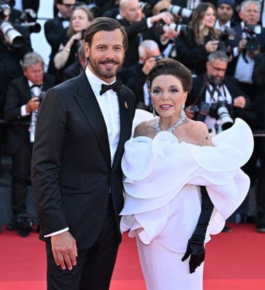 79th Cannes Film Festival: Opening Ceremony and the The Electric Kiss film screening CANNES, FRANCE - MAY 12: British actress Joan Collins (R) and French actor Laurent Lafitte (L) arrive for the Opening Ceremony and the screening of the film La Venus electrique (The Electric Kiss) at the 79th edition of the Cannes Film Festival in Cannes, France on May 12, 2026. Mustafa Yalcin Anadolu Cannes France. Editorial use only. Please get in touch for any other usage.  Copyright: x2026xAnadoluxMustafaxYalcinx