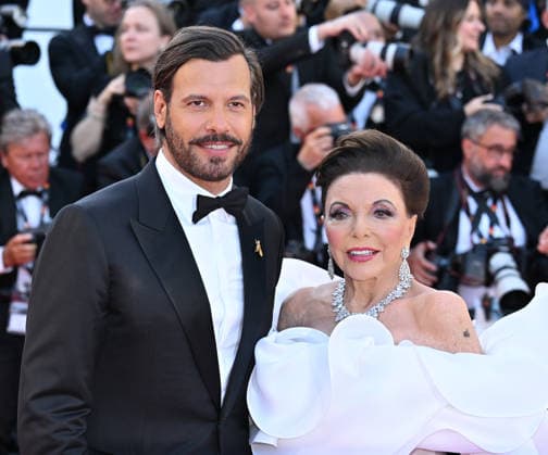 79th Cannes Film Festival: Opening Ceremony and the The Electric Kiss film screening CANNES, FRANCE - MAY 12: British actress Joan Collins (R) and French actor Laurent Lafitte (L) arrive for the Opening Ceremony and the screening of the film La Venus electrique (The Electric Kiss) at the 79th edition of the Cannes Film Festival in Cannes, France on May 12, 2026. Mustafa Yalcin Anadolu Cannes France. Editorial use only. Please get in touch for any other usage.  Copyright: x2026xAnadoluxMustafaxYalcinx