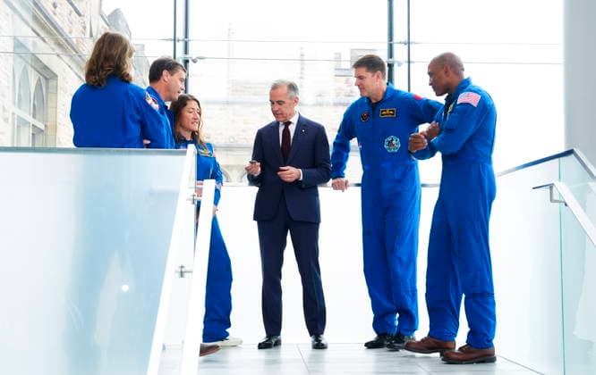 May 13, 2026, Ottawa, On, Canada: Prime Minister Mark Carney, centre, is presented with a Artemis Challenge Coin from astronauts of the Artemis II mission, Artemis Capsule Communicator Jenni Gibbons, left to right, Commander Reid Wiseman, Mission Specialist Christina Koch, Mission Specialist Jeremy Hansen, and Pilot Victor Glover, as they arrive to visit with students at the Museum of Nature in Ottawa on Wednesday, May 13, 2026. Ottawa Canada - ZUMAc35_ 20260513_zaf_c35_034 Copyright: xSeanxKilpatrickx