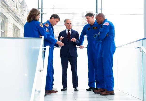 May 13, 2026, Ottawa, On, Canada: Prime Minister Mark Carney, middle, is presented with a Artemis Challenge Coin from astronauts of the Artemis II mission, Artemis Capsule Communicator Jenni Gibbons, left to right, Commander Reid Wiseman, Mission Specialist Christina Koch (hidden), Mission Specialist Jeremy Hansen, and Pilot Victor Glover, as they arrive to visit with students at the Museum of Nature in Ottawa on Wednesday, May 13, 2026. Ottawa Canada - ZUMAc35_ 20260513_zaf_c35_035 Copyright: xSeanxKilpatrickx
