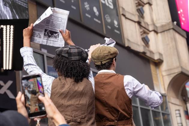 May 13, 2026, Bronx, New York, USA: New York, NY, USA, May 13, 2026: Atmosphere outside of movie theater as actors dressed as paperboys offer fake newspaper ahead of world premiere of Amazon Prime Video s Spider Noir at Regal Times Square. Bronx USA - ZUMAr339 20260513_znp_r339_007 Copyright: xLevxRadinx