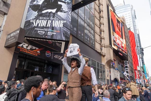 May 13, 2026, Bronx, New York, USA: New York, NY, USA, May 13, 2026: Atmosphere outside of movie theater as actors dressed as paperboys offer fake newspaper ahead of world premiere of Amazon Prime Video s Spider Noir at Regal Times Square. Bronx USA - ZUMAr339 20260513_znp_r339_009 Copyright: xLevxRadinx