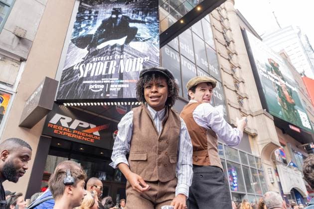 May 13, 2026, Bronx, New York, USA: New York, NY, USA, May 13, 2026: Atmosphere outside of movie theater as actors dressed as paperboys offer fake newspaper ahead of world premiere of Amazon Prime Video s Spider Noir at Regal Times Square. Bronx USA - ZUMAr339 20260513_znp_r339_011 Copyright: xLevxRadinx