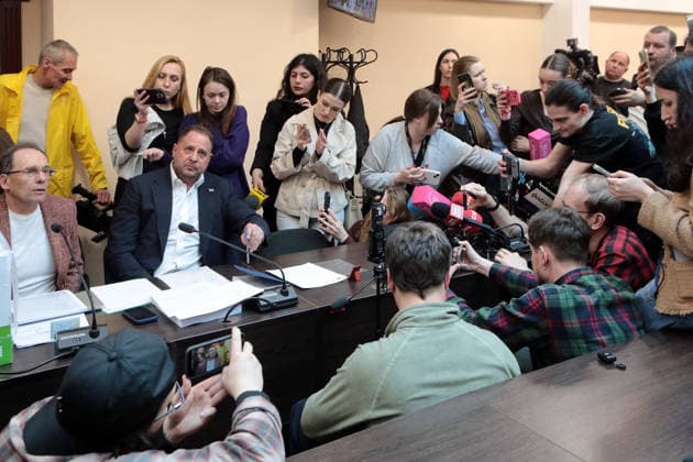 Ukraine Court Orders Arrest of Zelenskyy Ally Andriy Yermak - Kyiv Journalists are gathered near former head of the Office of the President of Ukraine Andriy Yermak (2nd L), suspected of money laundering, and his lawyer Ihor Fomin during a hearing at the High Anti-Corruption Court of Ukraine (HACC) in Kyiv, Ukraine, on May 13, 2026. The hearing was set to consider a motion on a preventive measure. The Specialised Anti-Corruption Prosecutor?s Office requested that the suspect be held in custody with the alternative of bail set at UAH 180 million. Investigators allege that the former official was involved in laundering UAH 460 million through the construction of elite residences in the ?Dynastiia? (?Dynasty?) cottage town in the village of Ko  Copyright: xTarasovxVolodymyr Ukrinform ABACAx