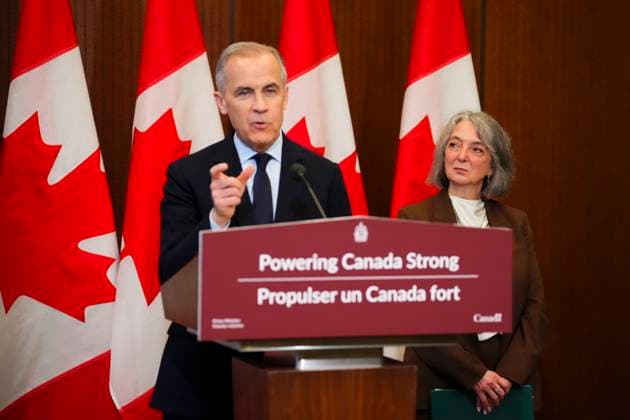 May 14, 2026, Ottawa, On, Canada: Prime Minister Mark Carney makes an announcement alongside Minister of Environment and Climate Change Julie Dabrusin, right, on Parliament Hill in Ottawa on Thursday, May 14, 2026. Ottawa Canada  - ZUMAc35_ 20260514_zaf_c35_010 Copyright: xSeanxKilpatrickx