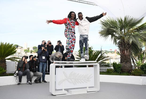 Congolese director Rafiki Fariala and actor Bradley Fiomona Dembeasset attend a photo call for Congo Boy at the 79th Cannes Film Festival in Cannes, France on Friday, May 15, 2026.  CAN20260515144 RUNExHELLESTAD