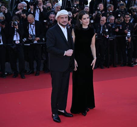 79th Cannes Film Festival: Karma screening CANNES, FRANCE - MAY 15: US director, screenwriter and writer John Travolta (L) and US actress Ella Bleu Travolta (R) arrive for the screening of the film Karma at the 79th edition of the Cannes Film Festival in Cannes, France on May 15, 2026. Mustafa Yalcin Anadolu Cannes France. Editorial use only. Please get in touch for any other usage.  Copyright: x2026xAnadoluxMustafaxYalcinx