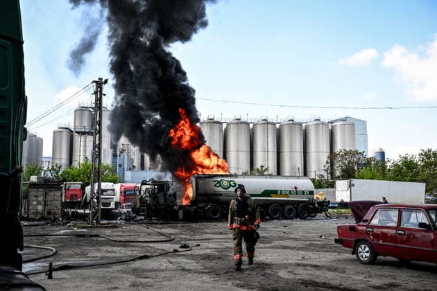 Russian troops strike fuel truck fleet in Zaporizhzhia A rescuer walks away from a burning tank truck used by a private company to supply petrol station chains after a drone strike in Zaporizhzhia, Ukraine, on May 15, 2026. The incident at an industrial facility resulted in damage to a fuel cistern and caused tank trucks to catch fire. One civilian employee, a driver, was killed, and three other company employees sustained serious injuries in the explosion. Zaporizhzhia Ukraine  Copyright: xDmytroxSmolienkox originalFilename: ukrinform-russiant260515_npWqY.jpg