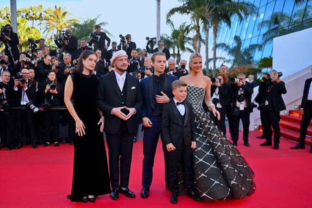 Cannes Karma Red Carpet. FC Olga Hoffmann, Kelly B. Eviston, Edouard Philipponnat, Clark Shotwell, Ella Bleu Travolta, John Travolta, Jason Berger and Amy Laslett attending the Karma red carpet during the 79th Cannes Film Festival in Cannes, France on May 15, 2026. Photo by Franck Castel ABACAPRESS.COM Cannes  Copyright: xCastelxFranck ABACAx