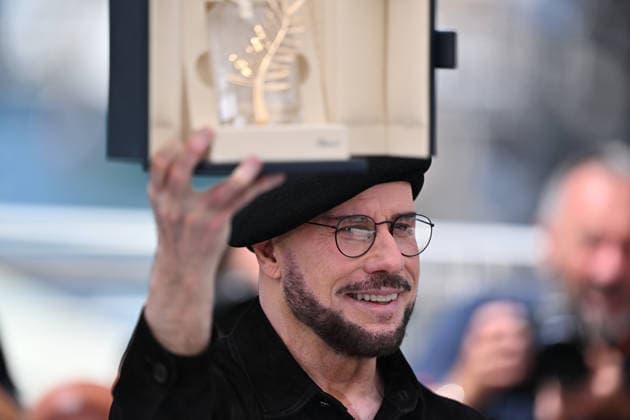 79th Cannes Film Festival: ‘Propeller One-Way Night Coach’ photocall CANNES, FRANCE - MAY 16: US director, screenwriter and writer John Travolta poses with an honourary lifetime achievement Palm d Or award during a photocall for the film ‘Propeller One-Way Night Coach’ at the 79th edition of the Cannes Film Festival in Cannes, France on May 16, 2026. Mustafa Yalcin Anadolu Cannes France. Editorial use only. Please get in touch for any other usage.  Copyright: x2026xAnadoluxMustafaxYalcinx