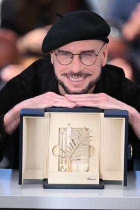 79th Cannes Film Festival: ‘Propeller One-Way Night Coach’ photocall CANNES, FRANCE - MAY 16: US director, screenwriter and writer John Travolta poses with an honourary lifetime achievement Palm d Or award during a photocall for the film ‘Propeller One-Way Night Coach’ at the 79th edition of the Cannes Film Festival in Cannes, France on May 16, 2026. Mustafa Yalcin Anadolu Cannes France. Editorial use only. Please get in touch for any other usage.  Copyright: x2026xAnadoluxMustafaxYalcinx