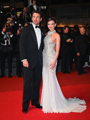 IPA84765406 - Cannes, 79th Cannes Film Festival 2026, Evening 5. Paper Tiger red carpet. Pictured: Miles Teller and Keleigh Sperry.  Copyright: xManuelexMangiarottix xPoolxPhotoxEventsx07x 84765406
