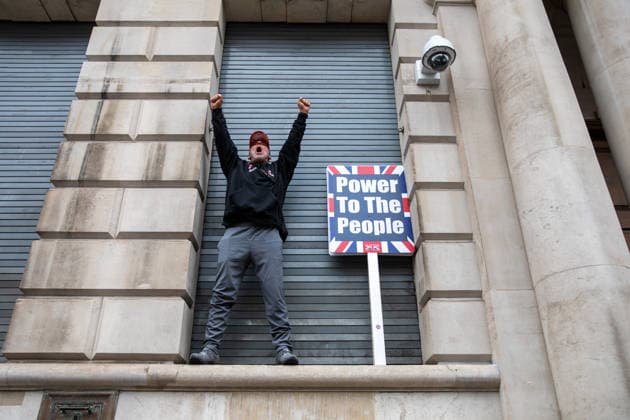 Unite The Kingdom March and rally in London - 16 May 2026 A Tommy Robinson supporter gestures during the Unite The Kingdom March and rally in London. The Unite the Kingdom march and rally held attracted large crowds to central London. Organized by Stephen Yaxley-Lennon, also known as Tommy Robinson, the event focused on immigration, border security, community cohesion and concerns surrounding radical Islam. Supporters described the rally as a defence of free speech, British Identity and national sovereignty, while critics said it risked deepening division and social tension within the United Kingdom. London United Kingdom Copyright: xJamesxWilloughbyx xSOPAxImagesx JWILLOUGHBY_2716