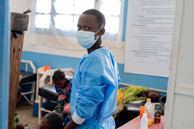 (260517) -- RWAMPARA, May 17, 2026 () -- A health worker wearing a mask is seen at the general reference hospital in Rwampara in eastern Democratic Republic of the Congo, on May 16, 2026. The death toll from the latest Ebola outbreak in the Democratic Republic of the Congo (DRC) has risen to 87, the Africa Centers for Disease Control and Prevention (Africa CDC) said Saturday, warning that the outbreak is driven by the Bundibugyo strain, for which no strain-specific vaccine is currently available, and that it carries a high risk of regional spread. (Str ) DR CONGO-RWAMPARA-EBOLA OUTBREAK-HOSPITAL Xinhua 