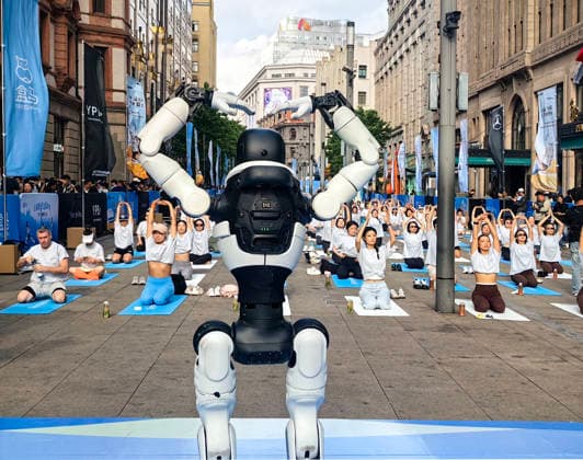 SHANGHAI, CHINA - MAY 16: Humanoid robot, together with over 100 yoga enthusiasts, takes part in the 6th Shanghai Yoga Lifestyle Festival on May 16, 2026 in Shanghai, China. Embodied robots joined the crowd to practice yoga during the festival.  Copyright: xVCGx 111641917537