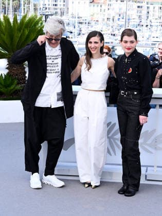 IPA84782032 - Cannes, 79th Cannes Film Festival 2026, Day 6. Photocall of the film I ll Be Gone In June. Pictured are Wim Wenders, Katharina Rivilis, Naomi Cosma  Copyright: xAlbertoxTerenghix xPoolxPhotoxEventsx07x 84782032