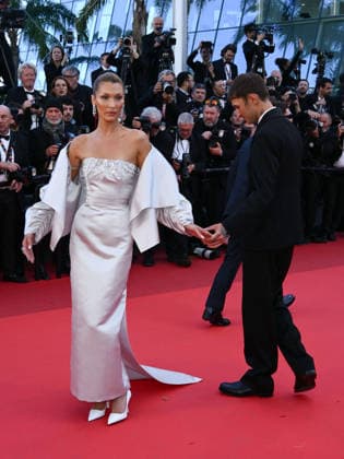 IPA84794585 - Cannes, 79th Cannes Film Festival 2026, Evening 6. Red Carpet film Garance Pictured: Bella Hadid with her brother Anwar Hadid  Copyright: xAlbertoxTerenghix xPoolxPhotoxEventsx07x 84794585
