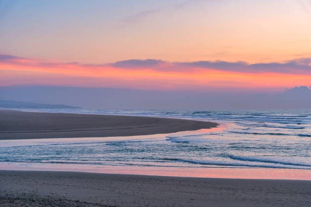 Scenic beach at sunset showing the Morocco coastline Asilah, Tangier-Tétouan-Al Hoceima, Morocco CR_UGOUSD260516-2022366-01