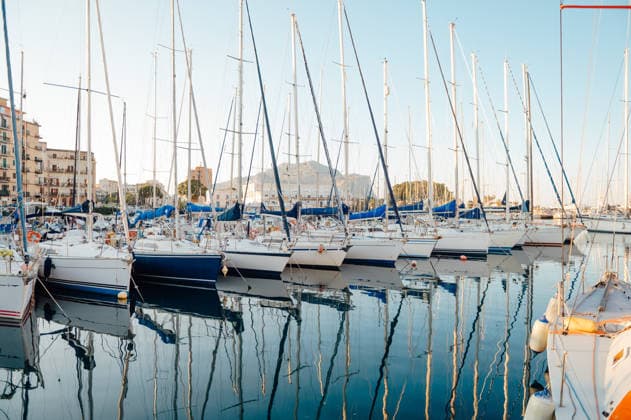 Sailboats reflected in Palermo marina with Monte Pellegrino Palermo, Sicily, Italy R_EPZT260516-2031477-01