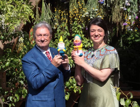 Sir Alan Titchmarsh and designer Frances Tophill pose with garden gnomes for charity at Chelsea Flower Show 2026 in London on Monday May 18, 2026.  LON2026051803 HUGOxPHILPOTT