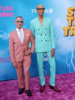Adam Shankman and RuPaul attend the Los Angeles premiere of Stop! That Train! at Harmony Gold on Monday, May 18, 2026. Storyline: Two train stewardess BFFs switch from a dull railway to the luxurious Glamazonian Express. During a massive storm, they must work with snooty first-class crew and President Gagwell to prevent disaster in LA.  LAP20260518607 GREGxGRUDT